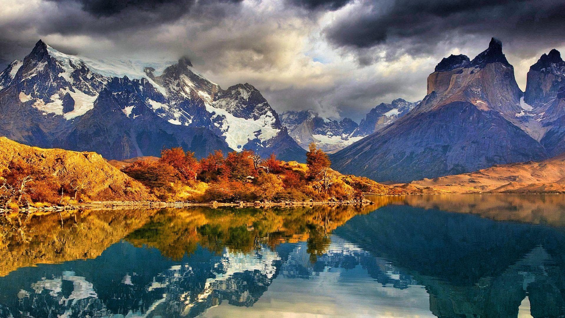 Torres del Paine dramatic peaks reflected in a turquoise lake in Patagonia