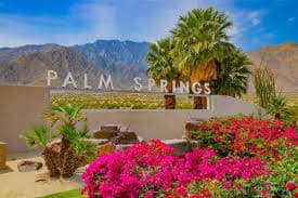 Palm Springs sign with mountains
